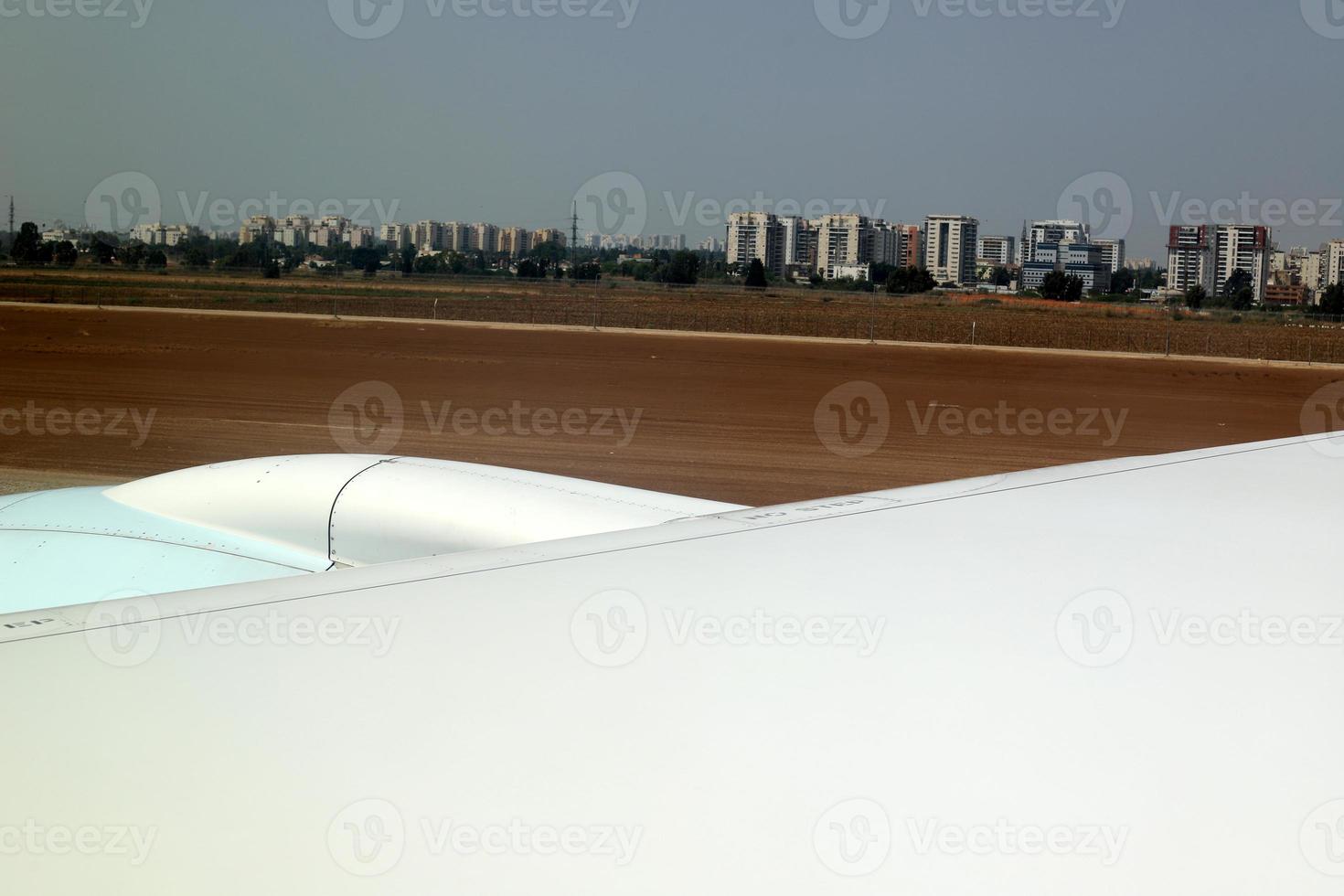 The earth is seen through the porthole of a large jet plane. photo