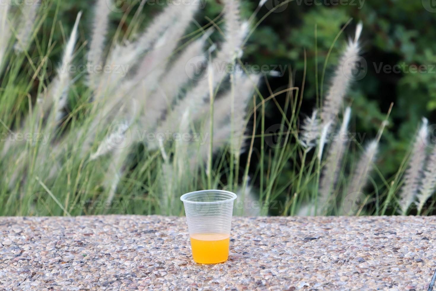 A non-alcoholic soft drink is poured into a glass. photo