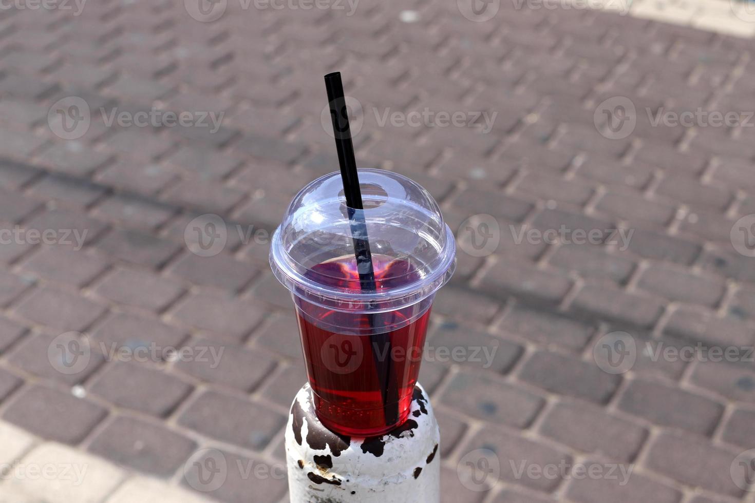 A non-alcoholic soft drink is poured into a glass. photo