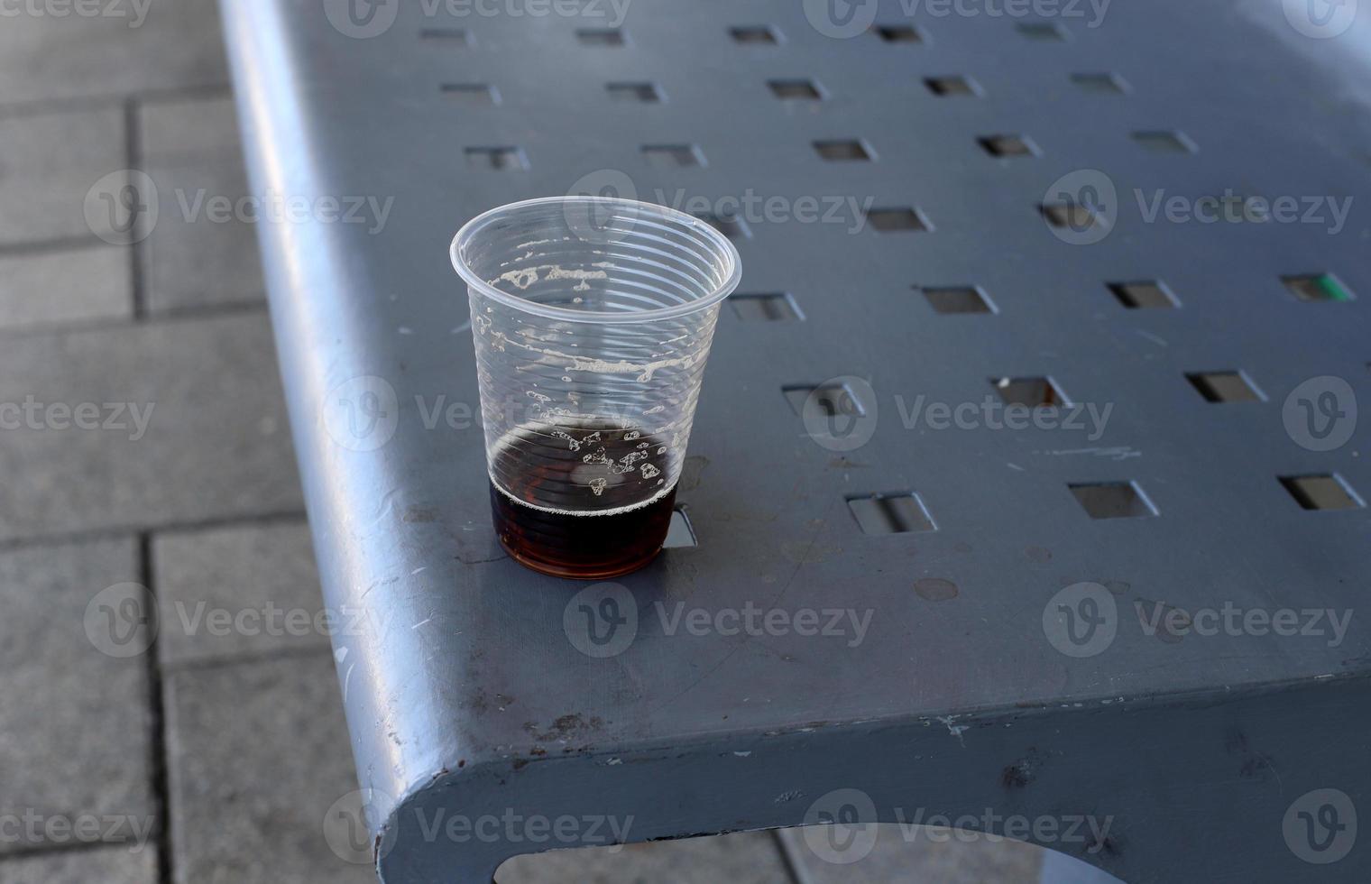 A non-alcoholic soft drink is poured into a glass. photo