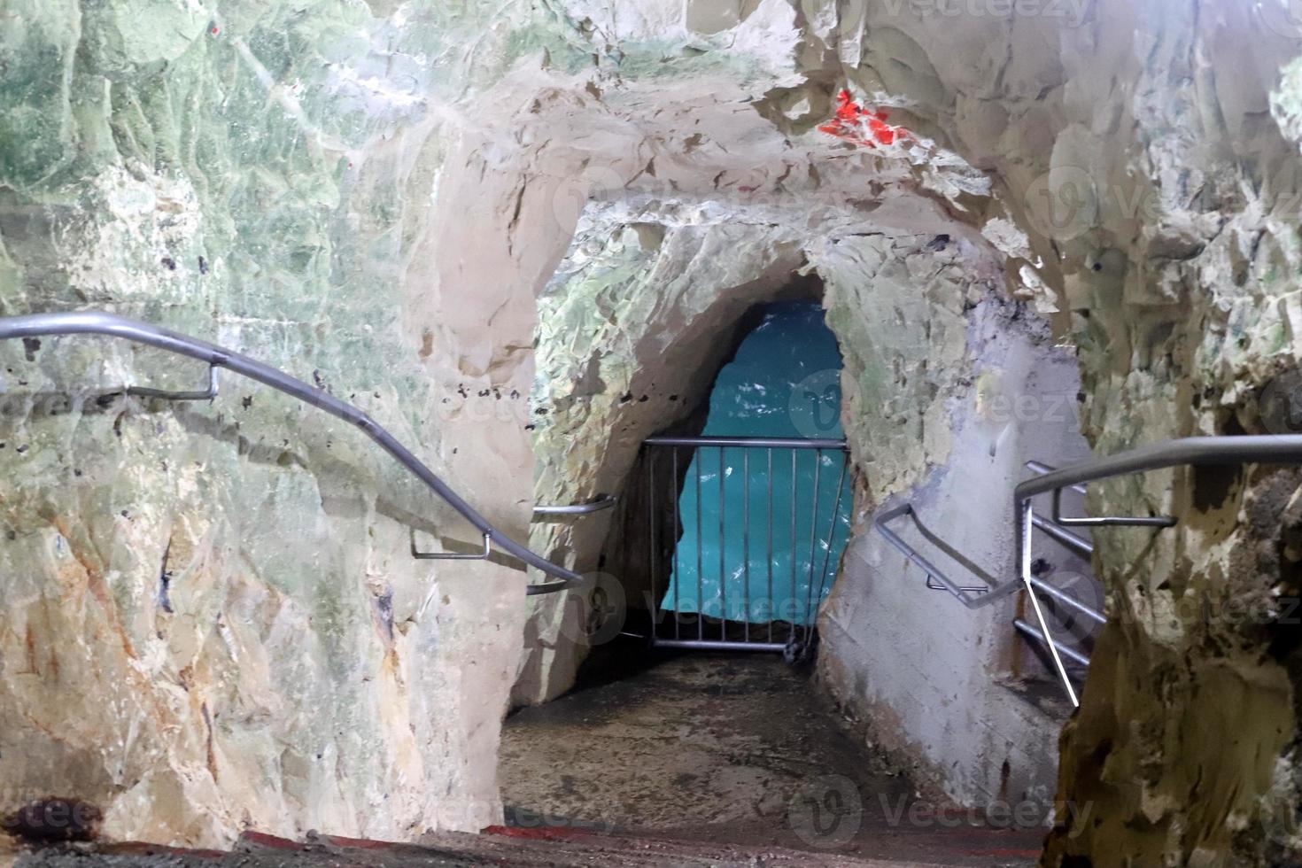 Grottoes in the chalk cliffs on the shores of the Mediterranean Sea. photo