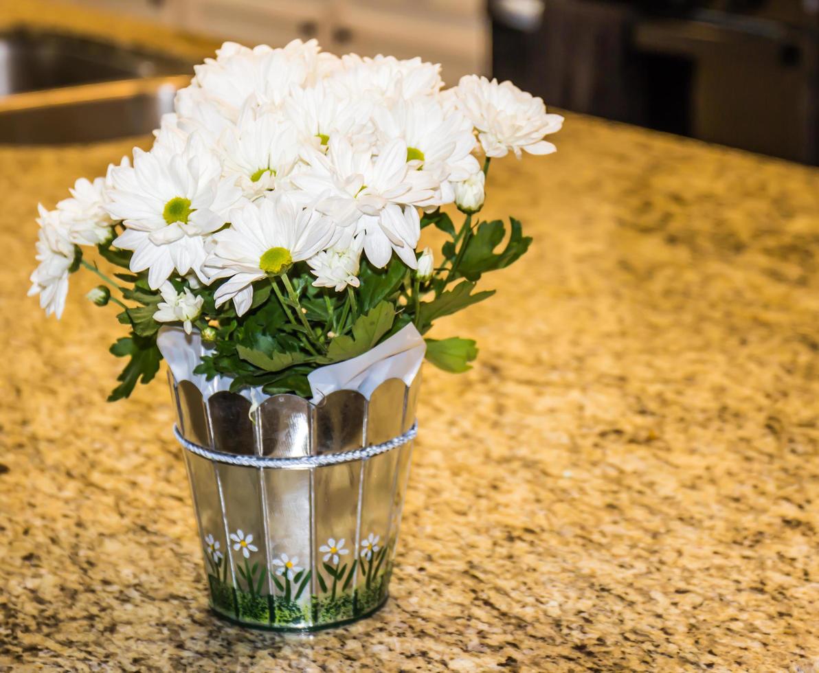 Arrangement Of Daisies On Kitchen Counter photo