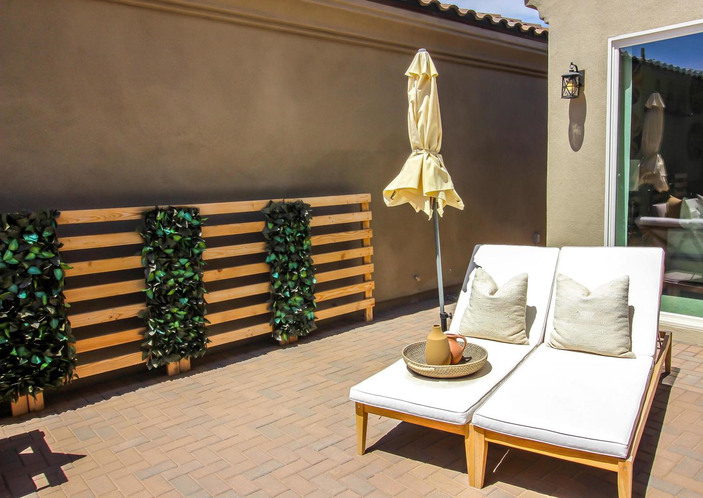 Two Lounge Chairs With Wicker Basket Of Pots photo