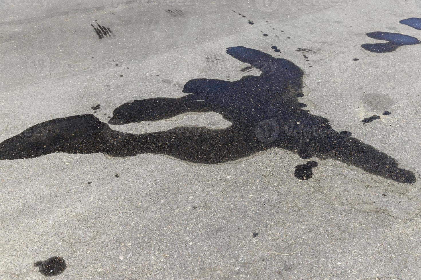 part of the paved road is blocked with waste from cars photo