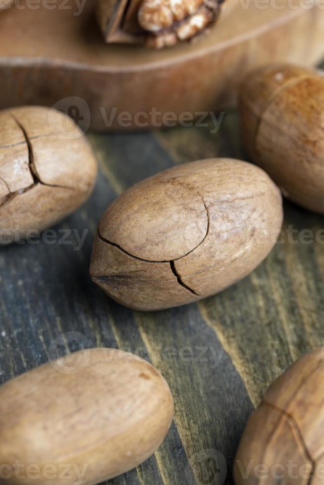 Pecan in a shell on the table photo