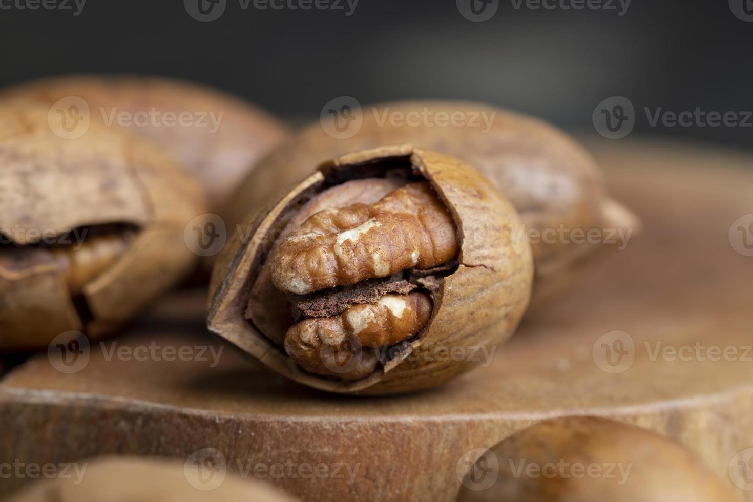 Pecan in a shell on the table photo