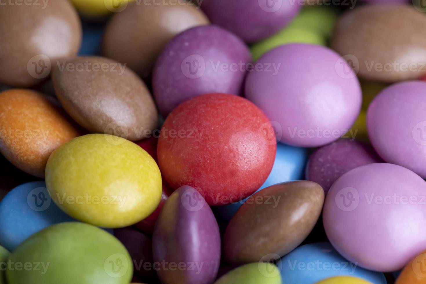 Multicolored chocolates with chocolate filling photo