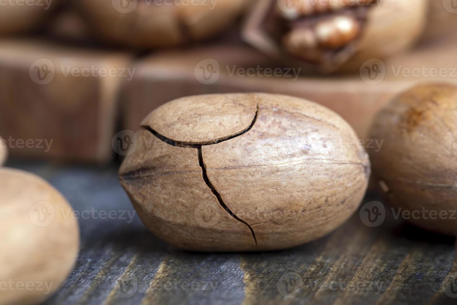 Pecan in a shell on the table photo