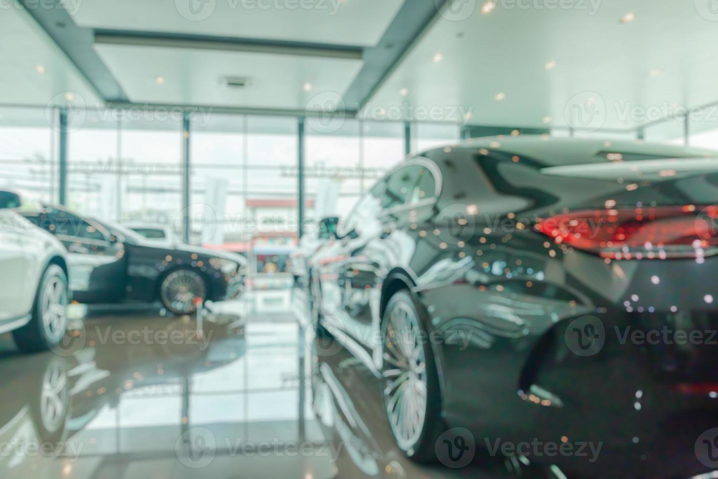 new cars in showroom interior blurred abstract background photo