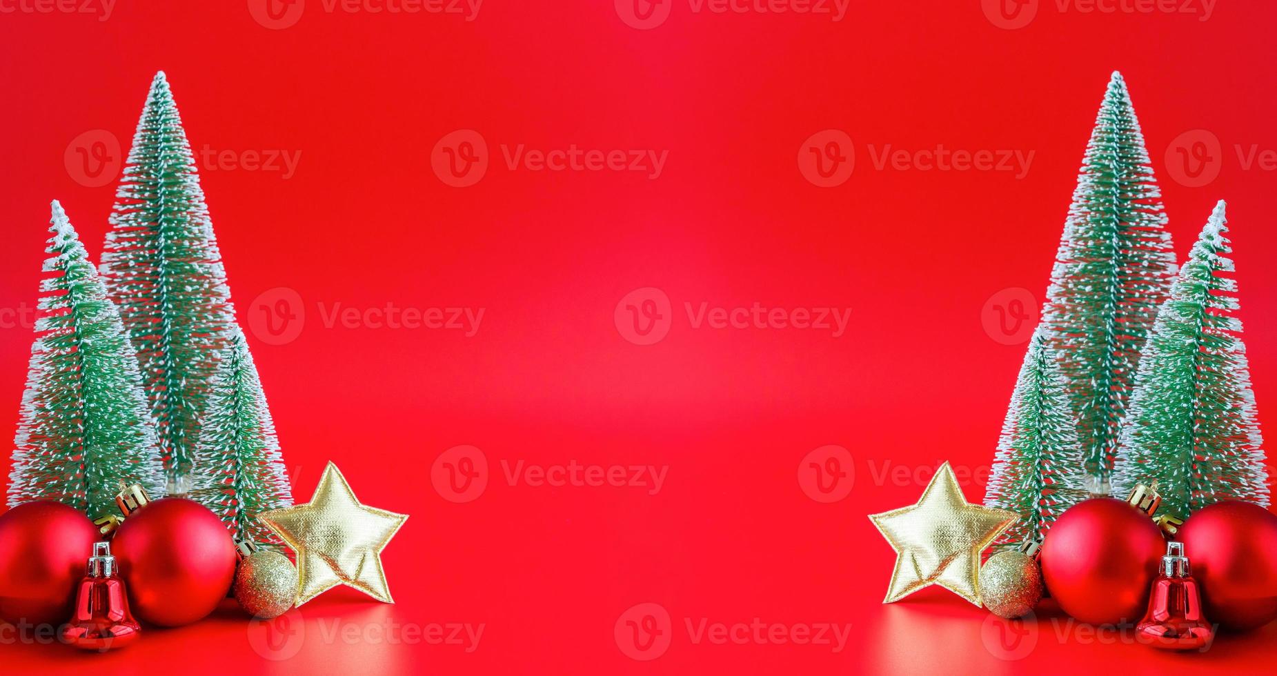 Christmas tree and baubles on red background new year  holiday celebration concept photo