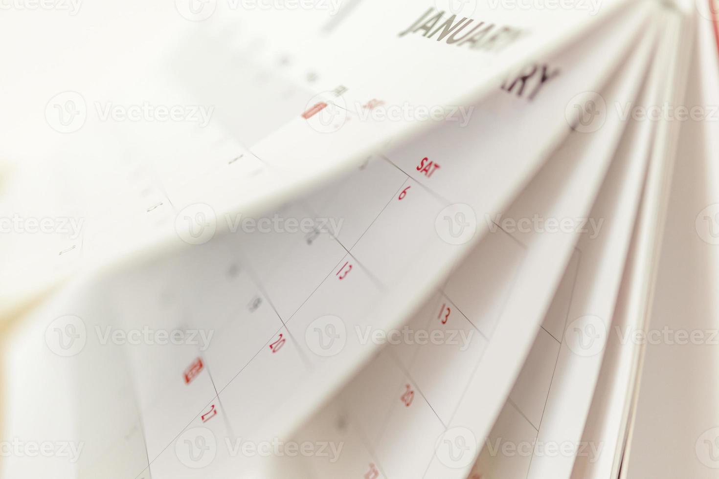 Calendar page flipping sheet close up blur background business schedule planning appointment meeting concept photo