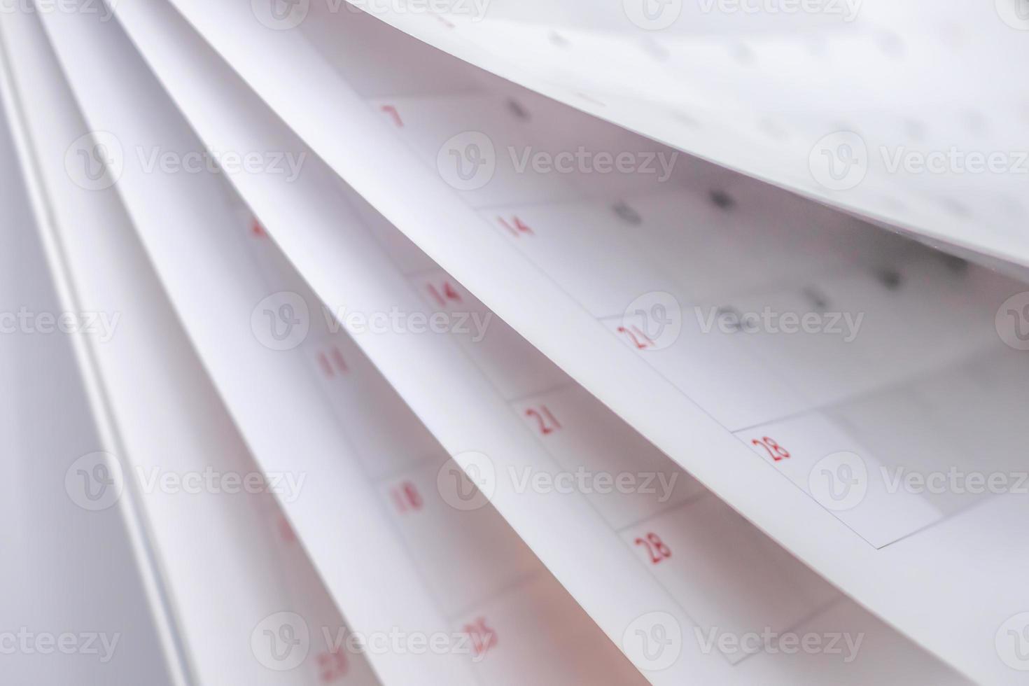 Calendar page flipping sheet close up blur background business schedule planning appointment meeting concept photo