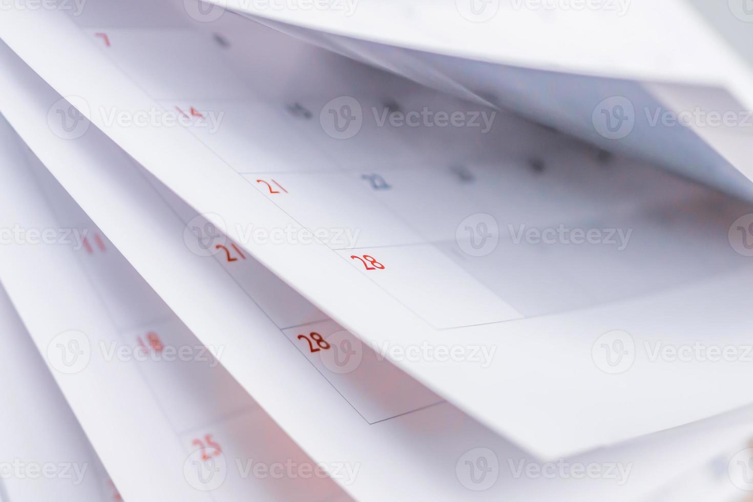 Calendar page flipping sheet close up blur background business schedule planning appointment meeting concept photo