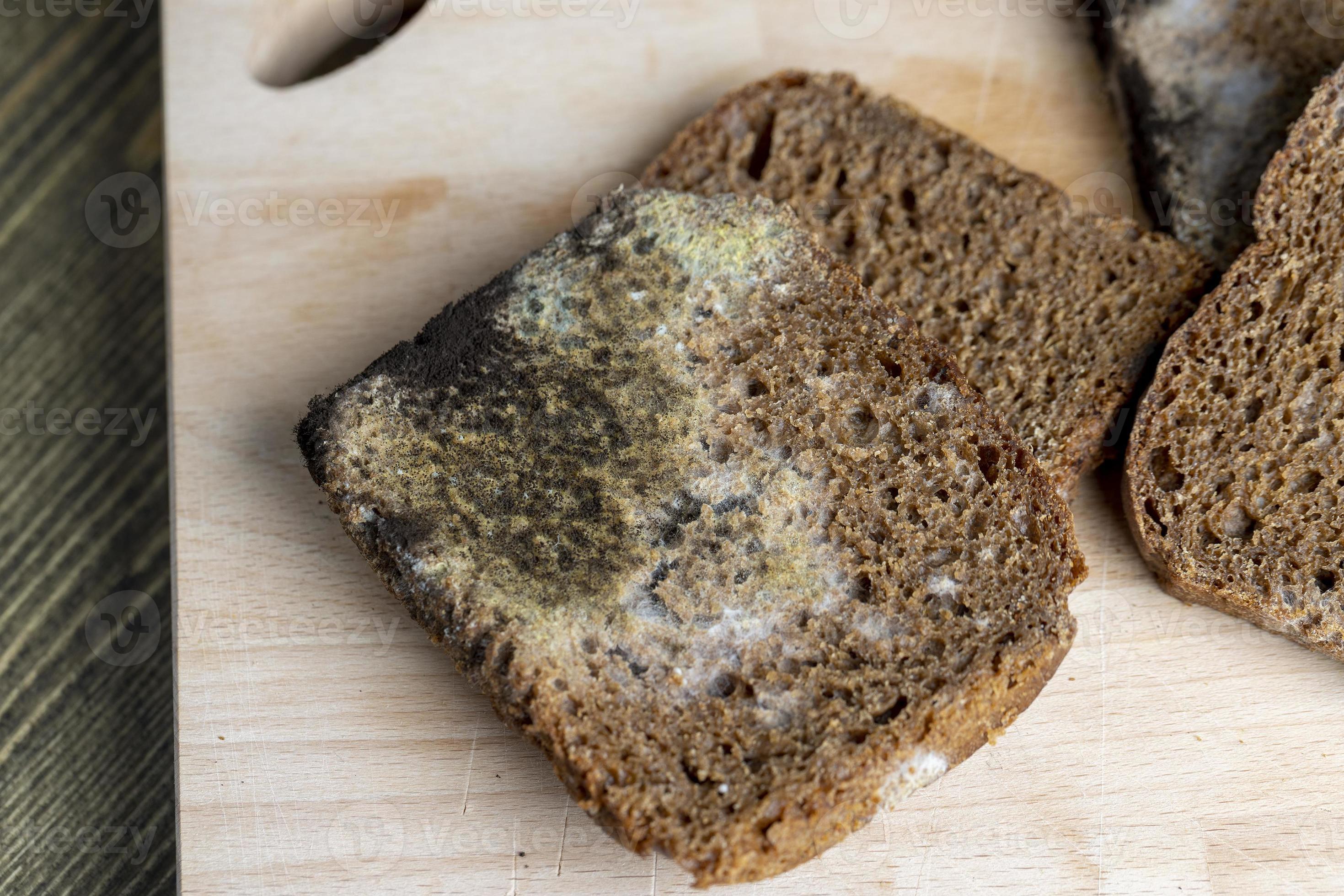 Black rye bread in mold on the board 13659298 Stock Photo at Vecteezy