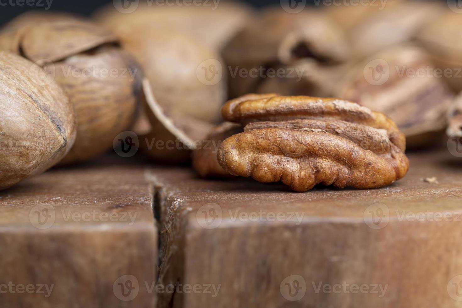 Pecan in a shell on the table photo