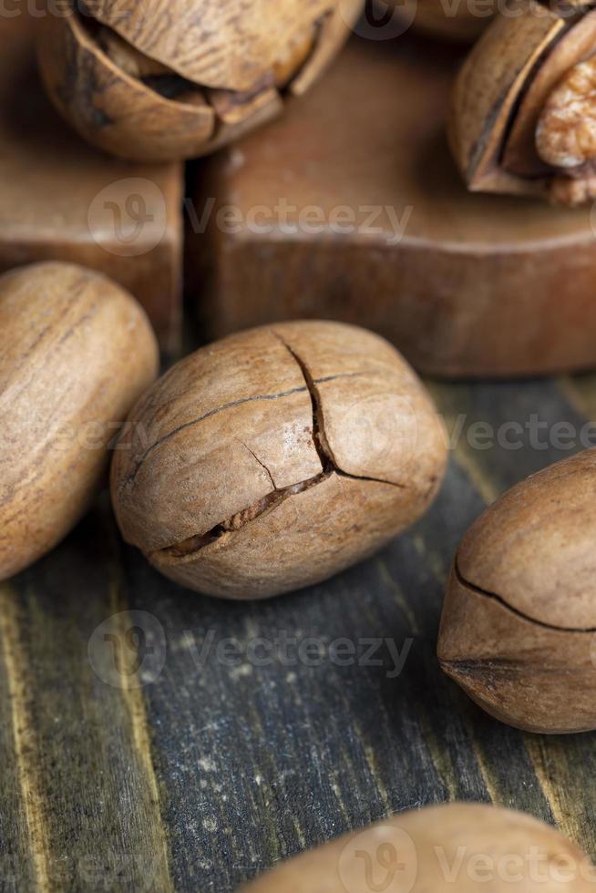 Pecan in a shell on the table photo