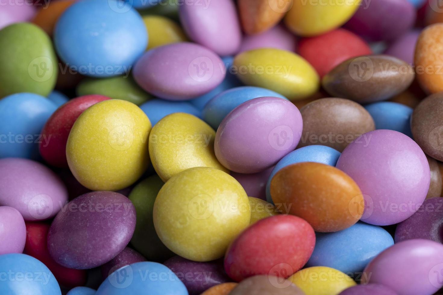 Multicolored chocolates with chocolate filling photo