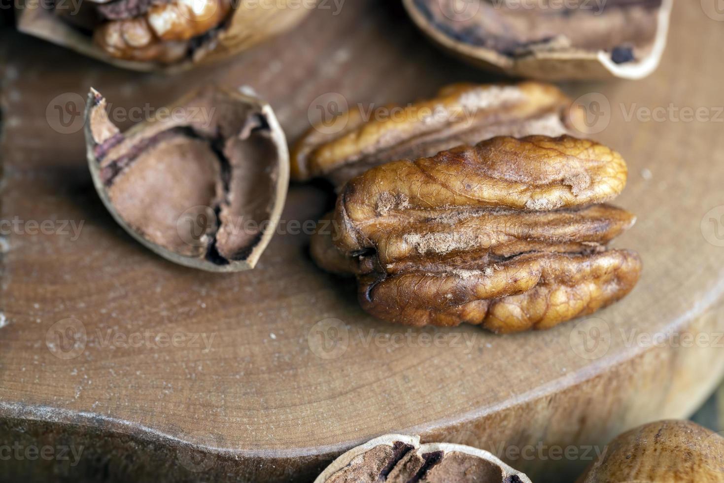 Pecan in a shell on the table photo