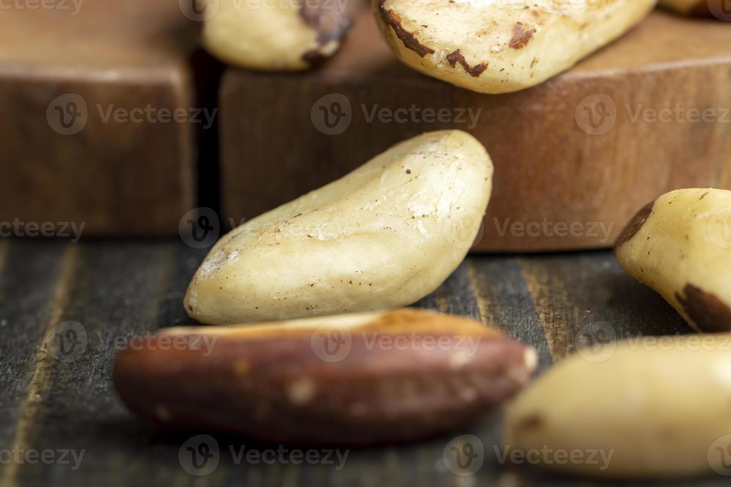 Peeled Brazil nuts on the table photo