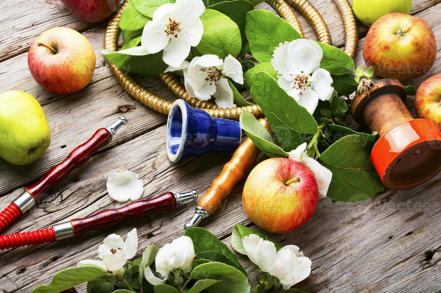 Eastern apple smoking hookah photo