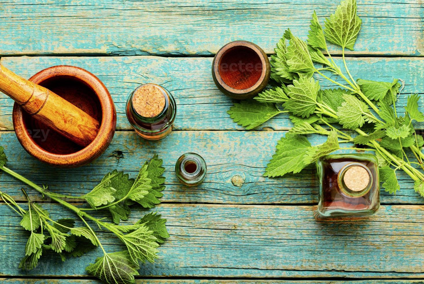 Glass bottle of nettle tincture photo