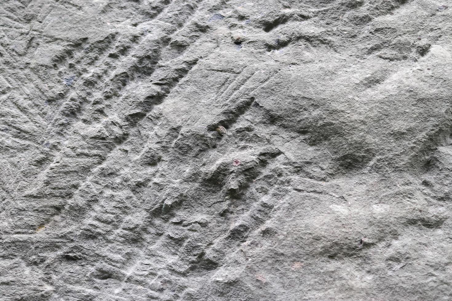 Detailed view on aged concrete walls with cracks and a lot of structure in high resolution photo