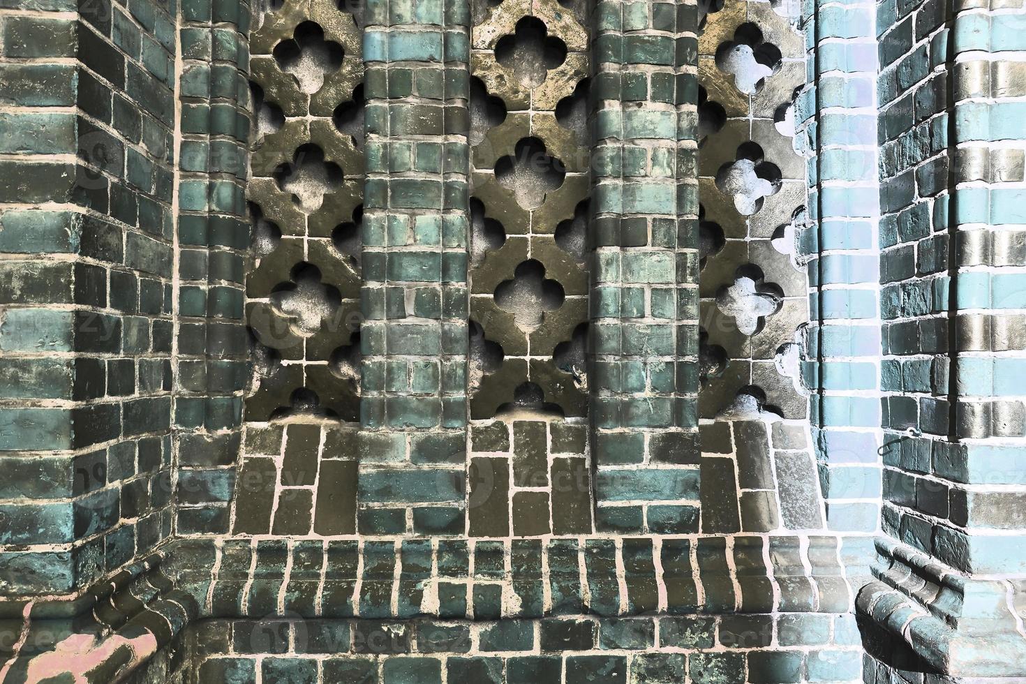 Detailed view at a colorful old and weathered brick wall texture as a panoramic background. photo