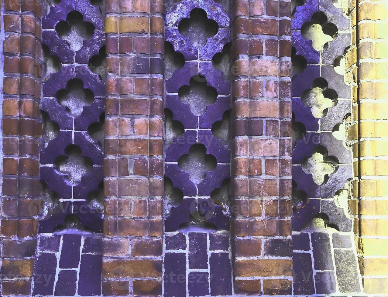 Detailed view at a colorful old and weathered brick wall texture as a panoramic background. photo