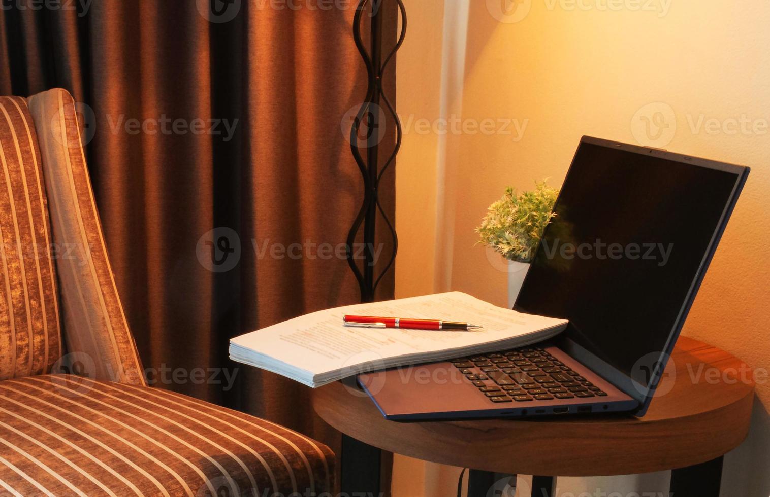 red pen on blurred proofreading paper in office photo