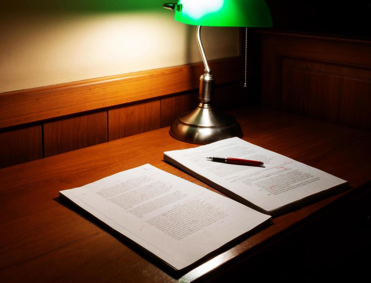 blurred proofreading paper on wooden table photo