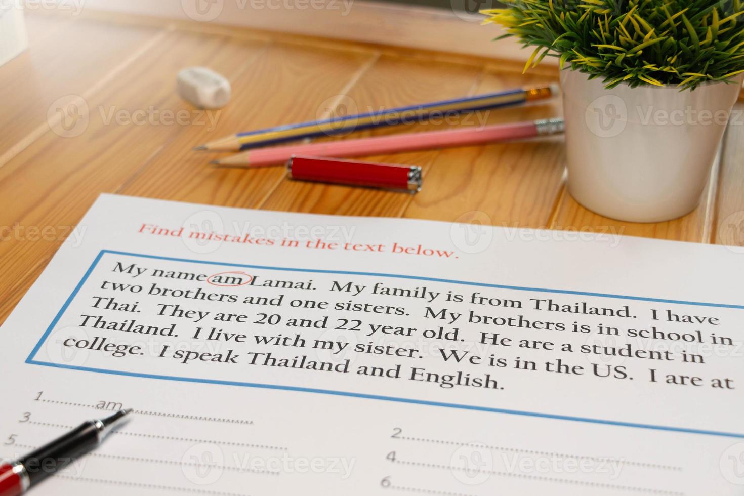 English exercise to find mistake grammar on wooden table photo