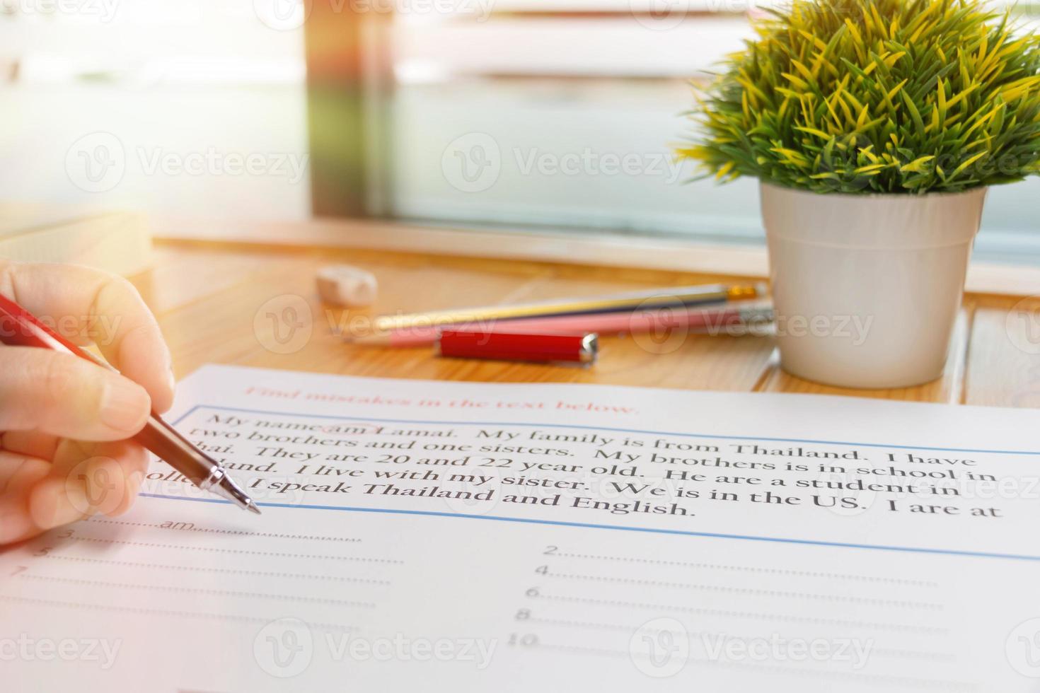 English exercise to find mistake grammar on wooden table photo