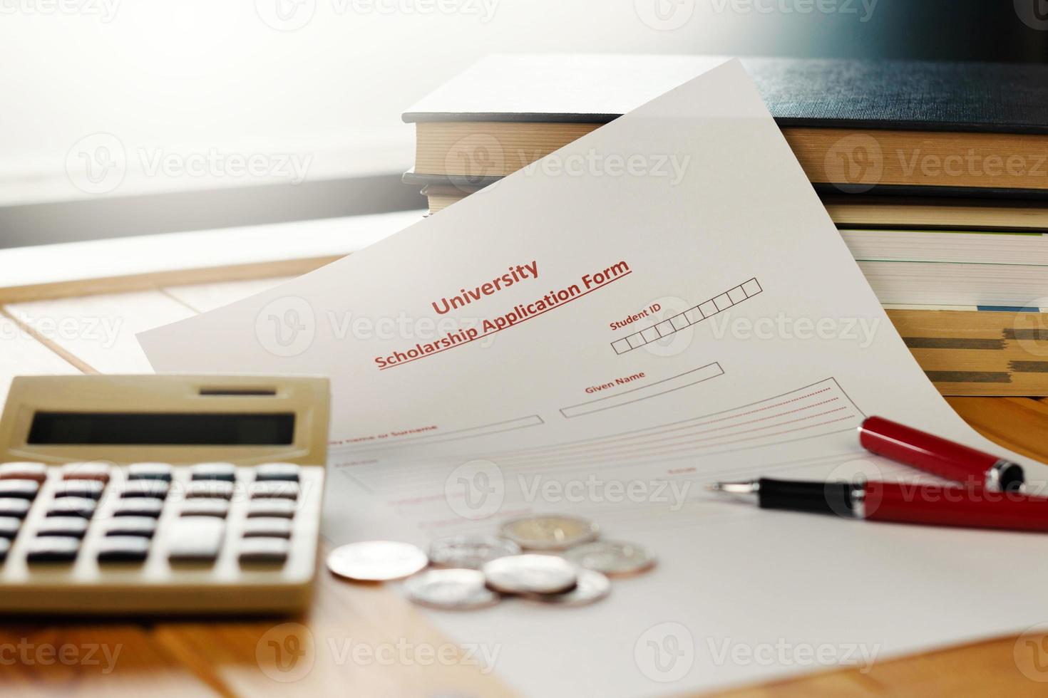 school scholarship application form on wooden table photo