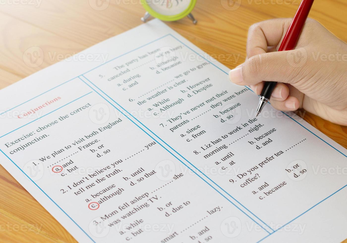 English grammar sheet on wooden table photo