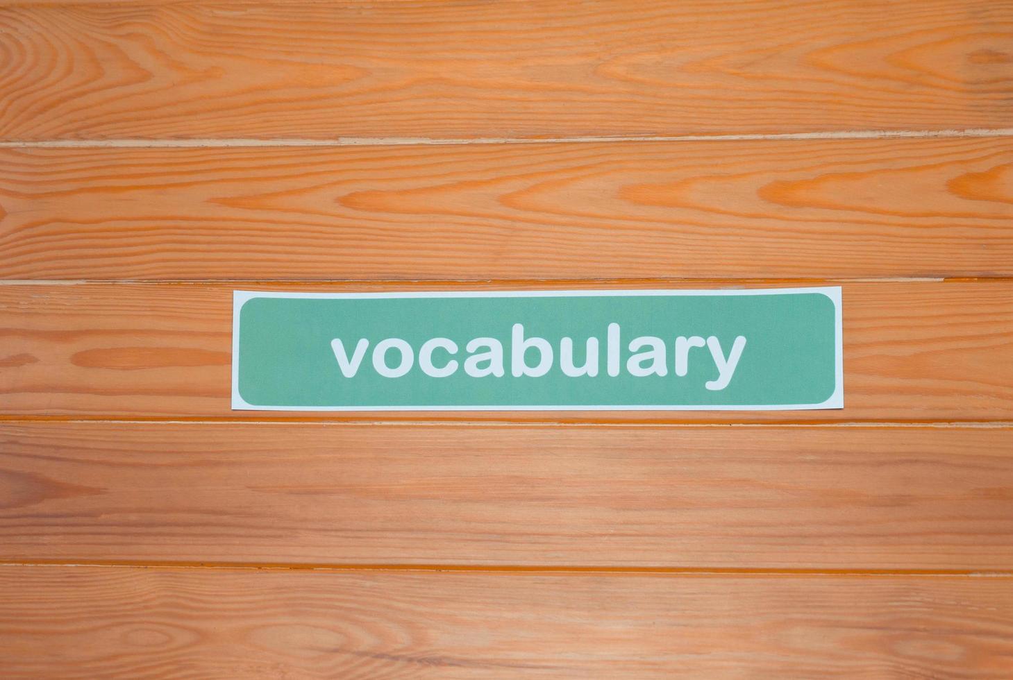 a single vocabulary card on wooden table photo
