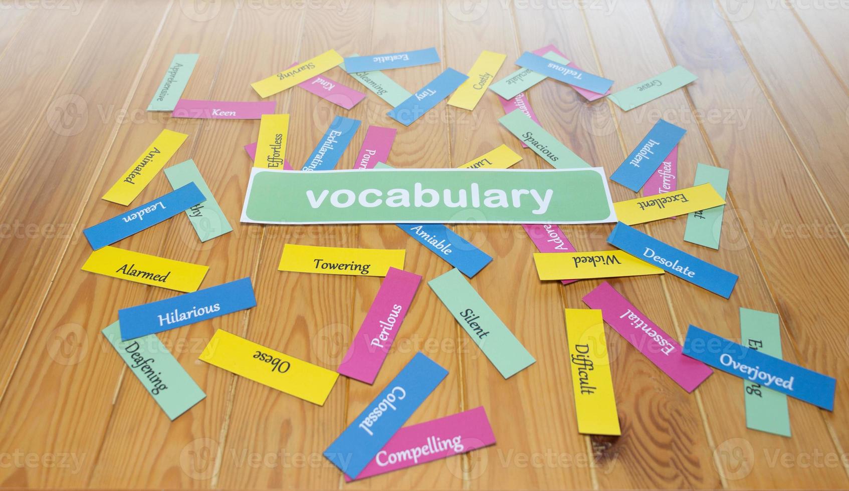 colorful English word cards on wooden table photo