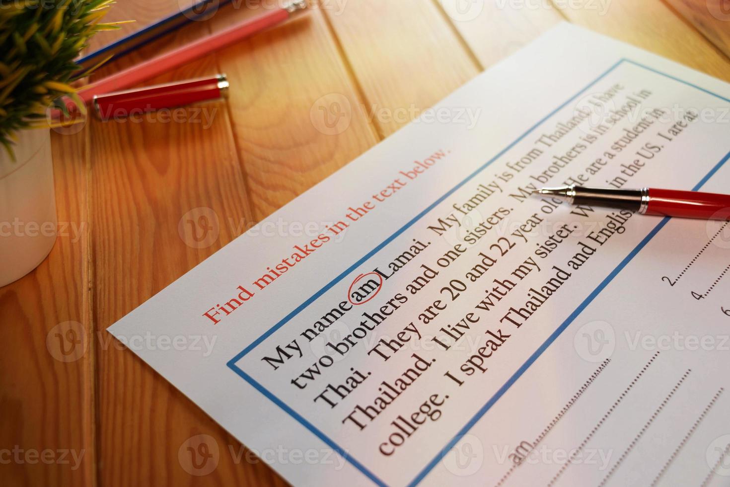 English exercise to find mistake grammar on wooden table photo
