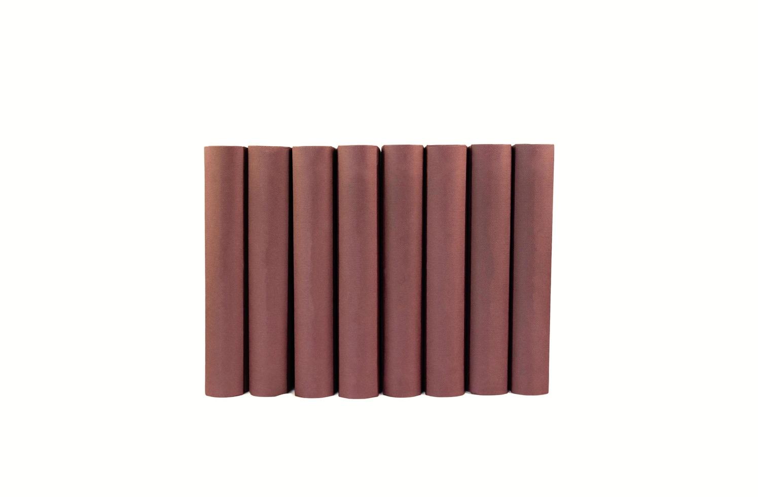 isolated stack of hardcover books on white background photo