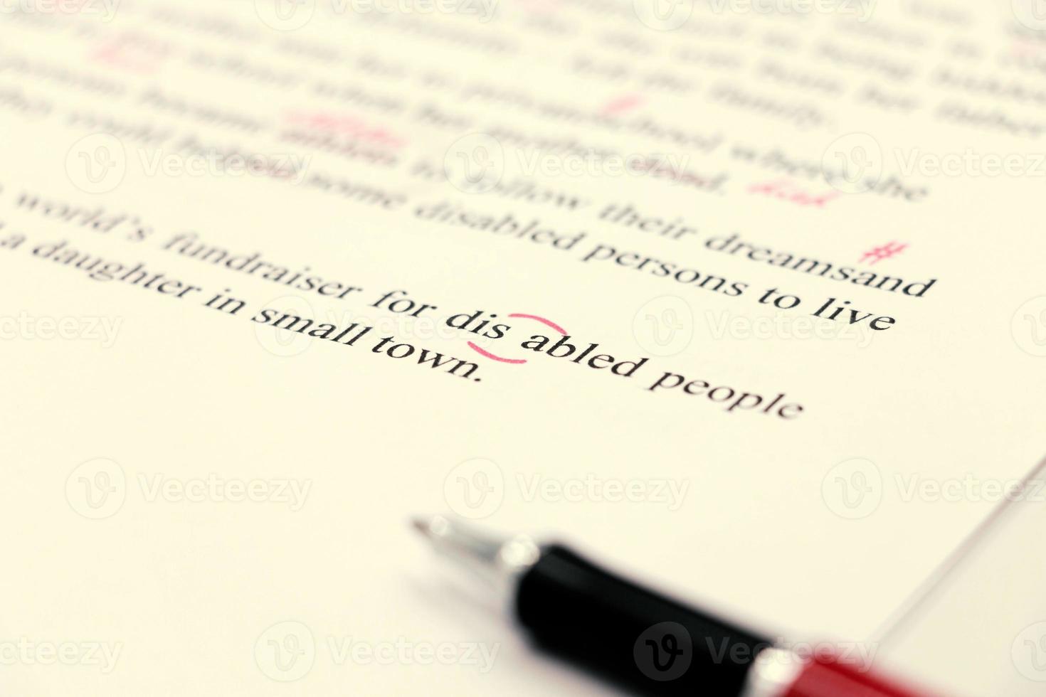 proofreading of English sentences on white paperwork photo