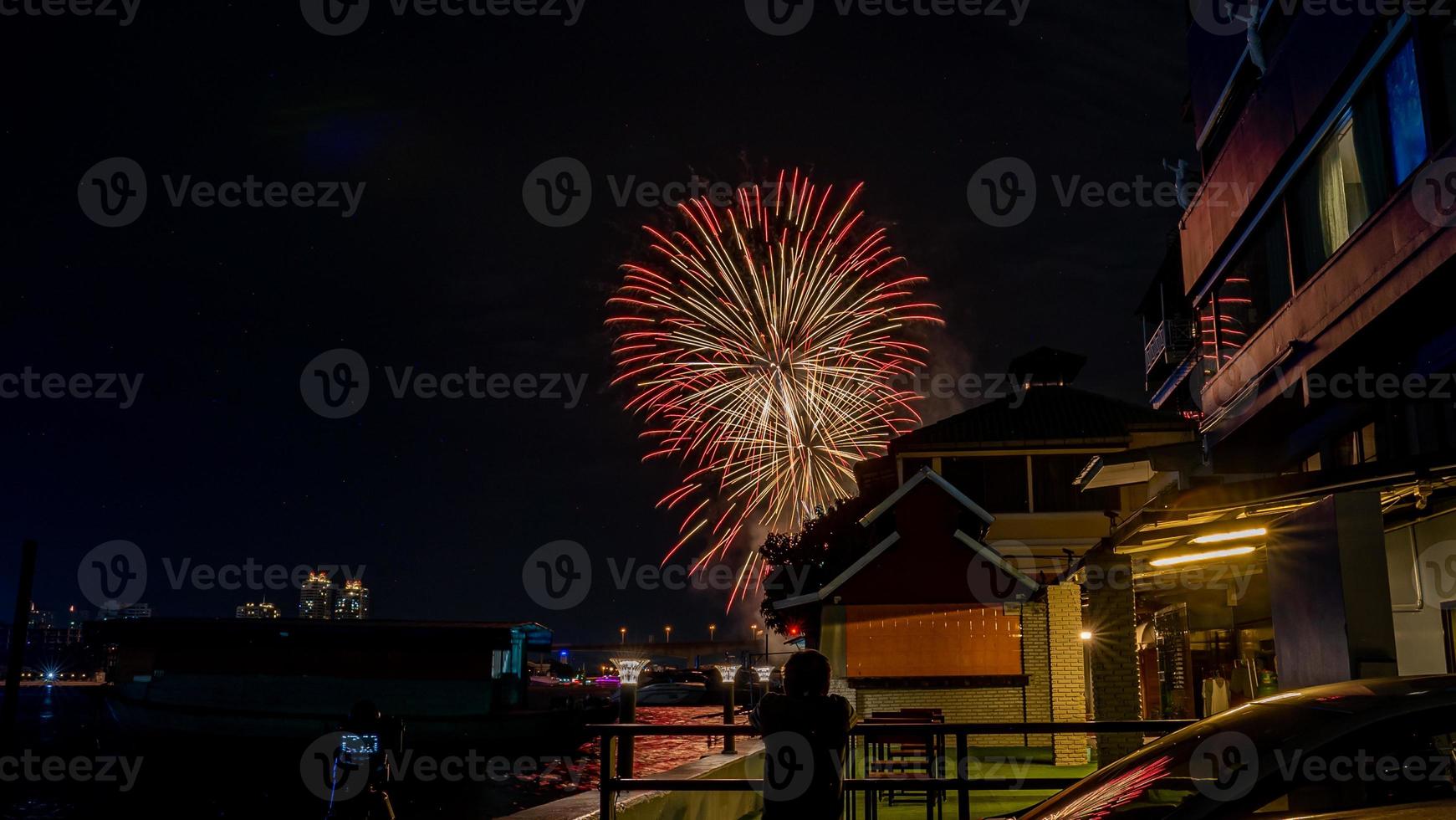 fireworks on the river in the dark sky photo