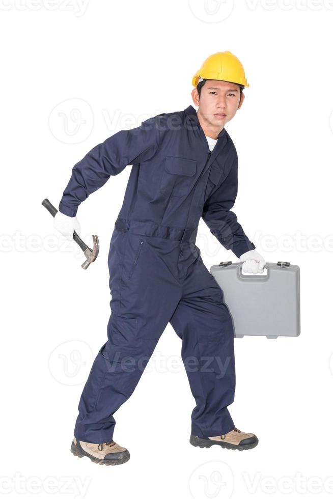 Young handyman  standing with his tool box photo