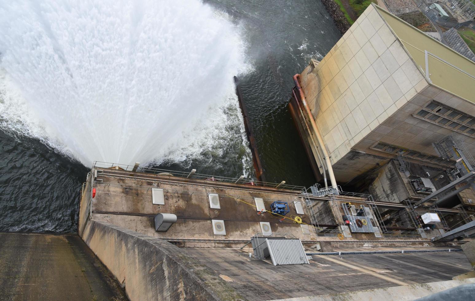 A spillway of dam to provide the controlled release of water from a dam or levee downstream. photo