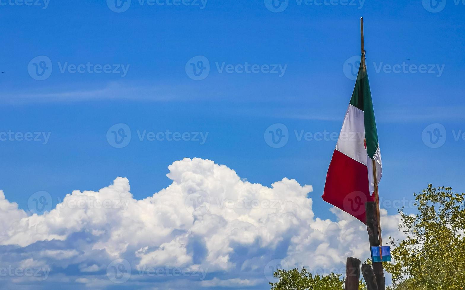 Mexican green white red flag on beautiful Holbox island Mexico. photo