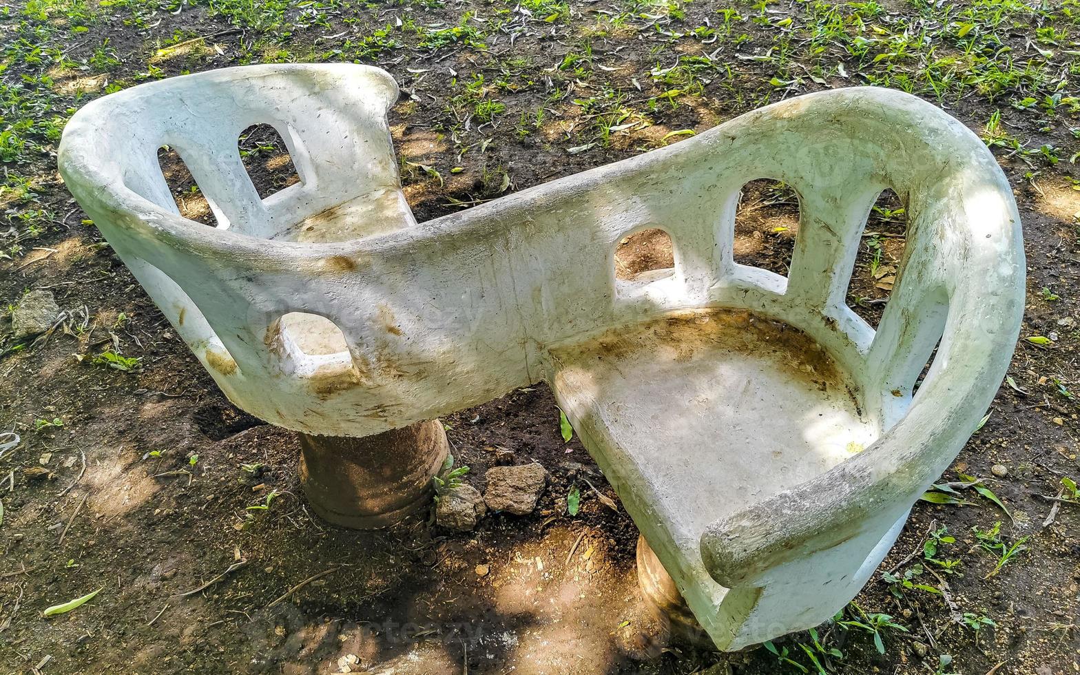 Artfully curved stone bench in city park Playa del Carmen. photo