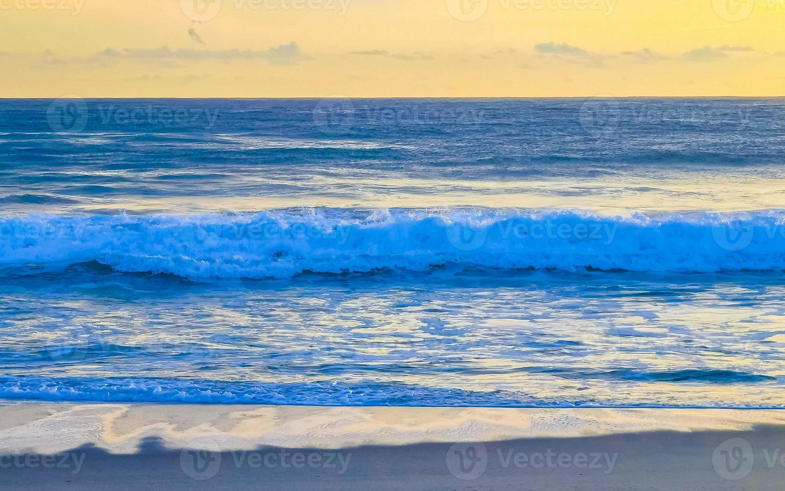 Colorful golden sunset big wave and beach Puerto Escondido Mexico. photo