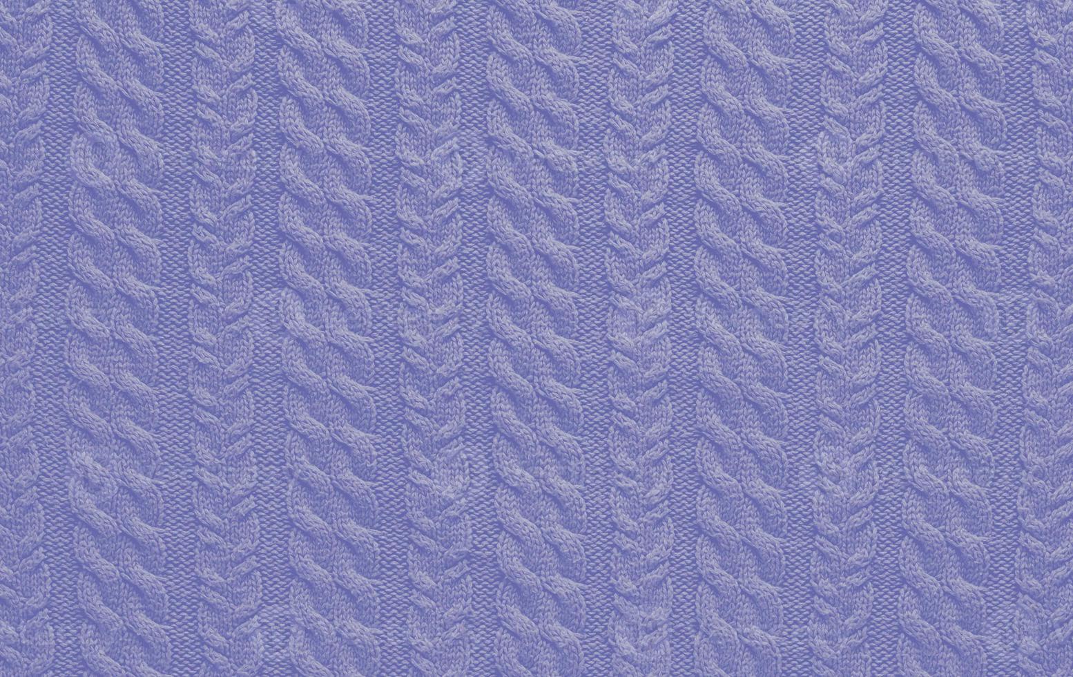 Texture of smooth knitted sweater with pattern. Handmade knitting wool or cotton fabric texture. Background of knitting patterns with a vertical Braid Cable. photo