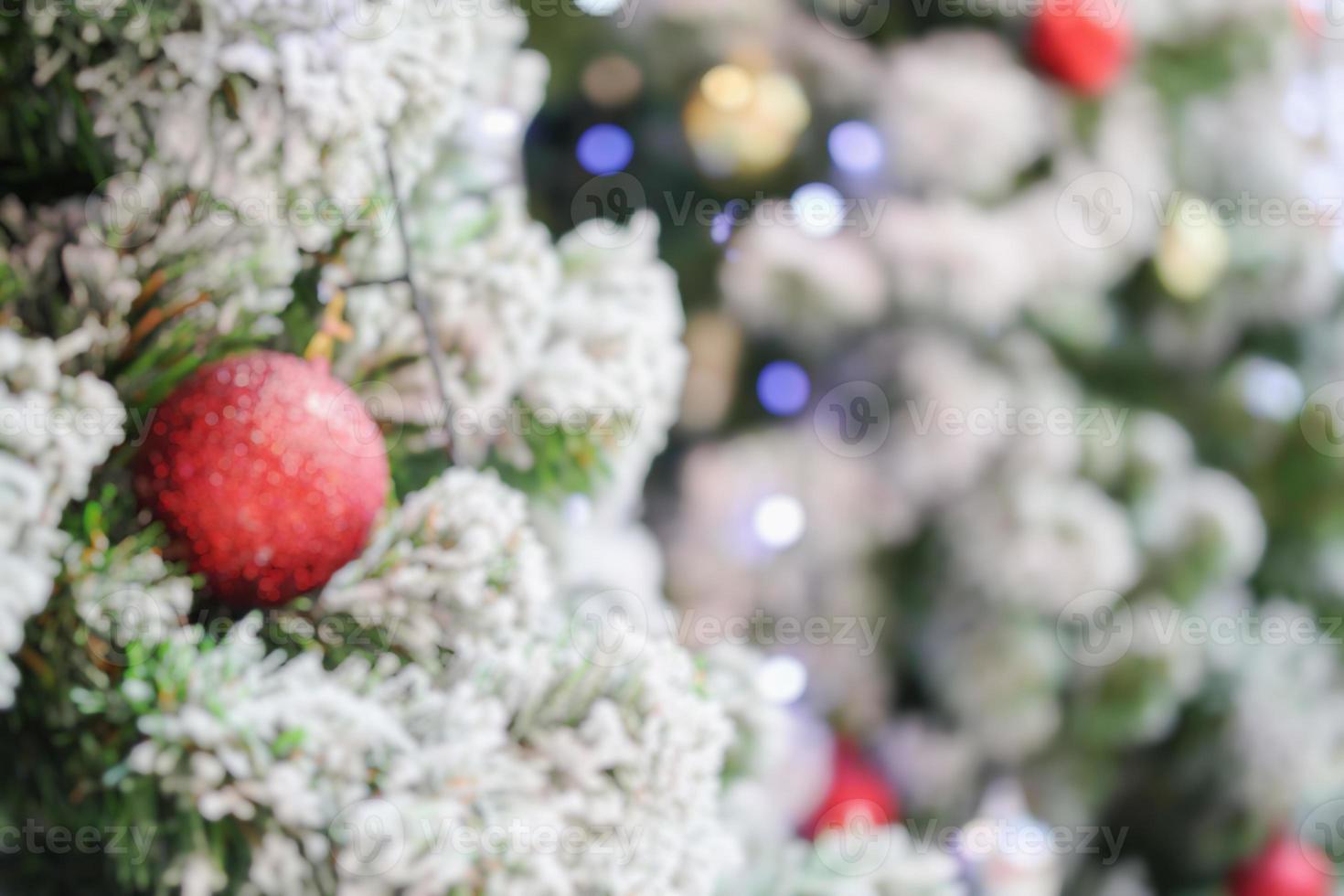 Abstract blurred christmas tree with bokeh light background photo