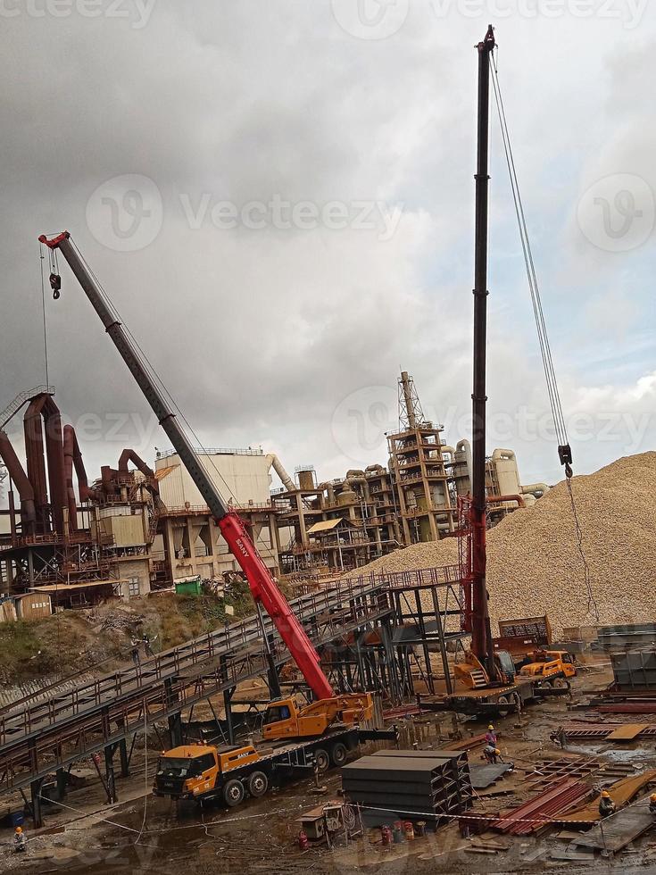 two cranes operating at the mine site good for lifting heavy objects photo