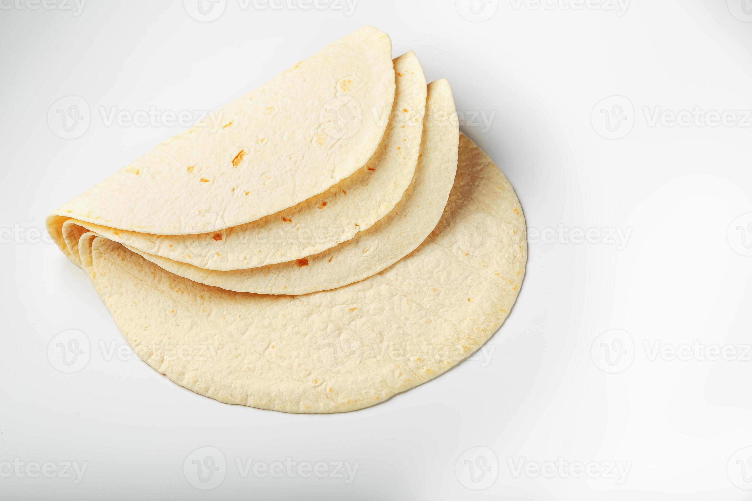 Tortilla on a white isolated background. Corn tortilla or simply