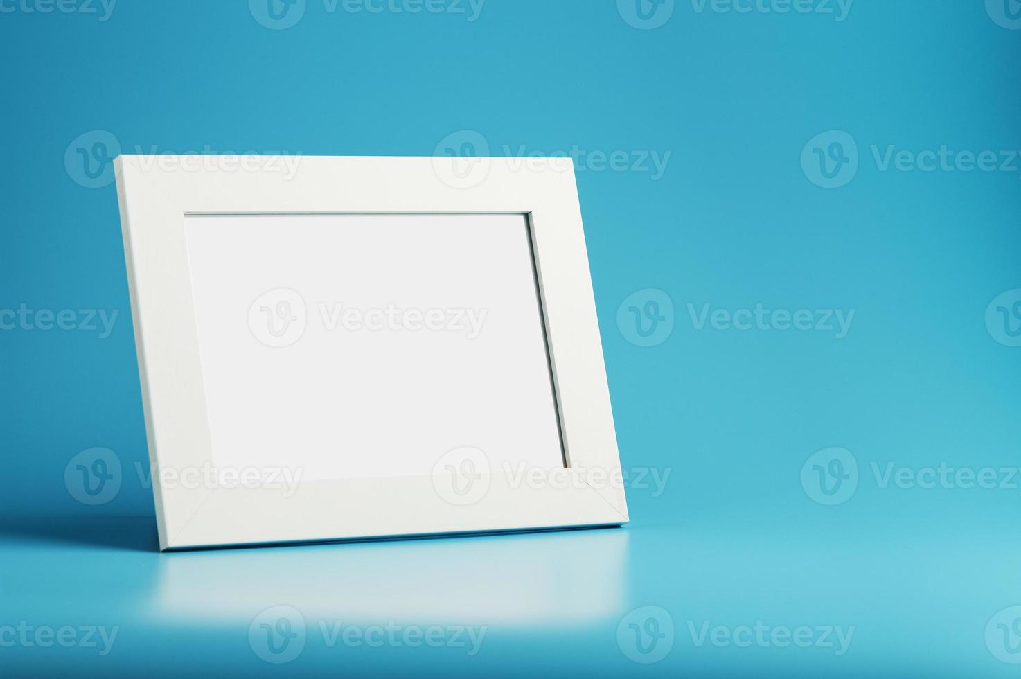 White and black photo frame with empty space on a blue background.